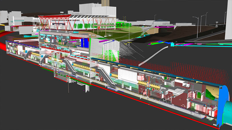 Una colorida representación en pantalla muestra la infraestructura ferroviaria sobre y bajo tierra en Brisbane